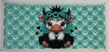 Cow with teal